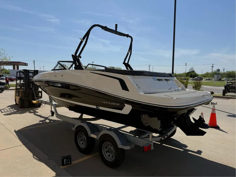 Slide: The Image of 2021 Bayliner VR5 Bowrider I/O on trailer, parked outdoors under clear sky. - 8