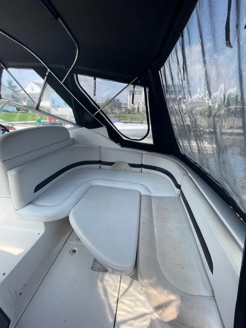 Slide: The Image of 2003 Chaparral Signature 290 interior with white seating and black canopy. - 5