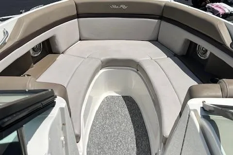 Slide: The Image of 2011 Sea Ray 250 SLX boat interior with cushioned seating and carpeted flooring. - 4