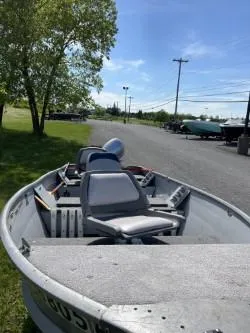 Slide: The Image of 1979 Sea Nymph Jon boat parked outdoors on a sunny day. - 4