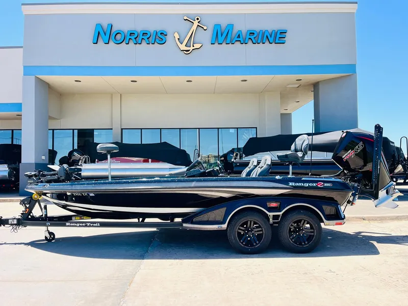 Slide: The Image of 2024 Ranger Z520R boat at Norris Marine dealership, side view. - 1