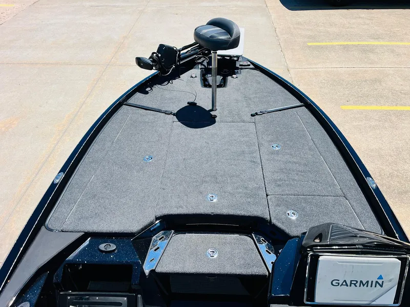Slide: The Image of 2024 Ranger Z520R boat deck with Garmin equipment, featuring a spacious, carpeted layout. - 12