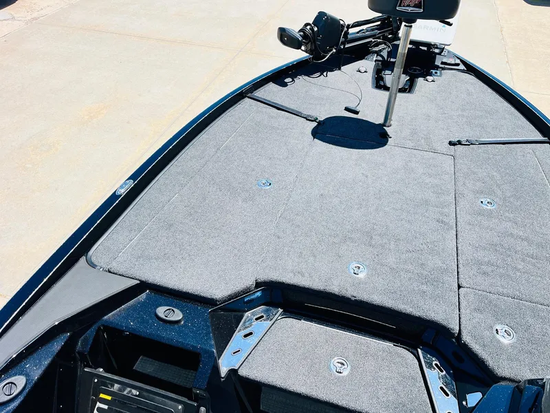 Slide: The Image of 2024 Ranger Z520R Ranger Cup Equipped boat deck with gray carpeting and fishing equipment. - 16