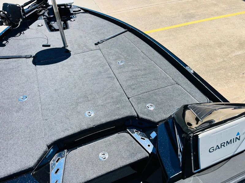 Slide: The Image of 2024 Ranger Z520R boat deck with Garmin equipment, featuring spacious storage and sleek design. - 17