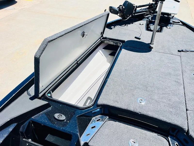 Slide: The Image of 2024 Ranger Z520R boat storage compartment open, showcasing spacious interior and sleek design. - 18