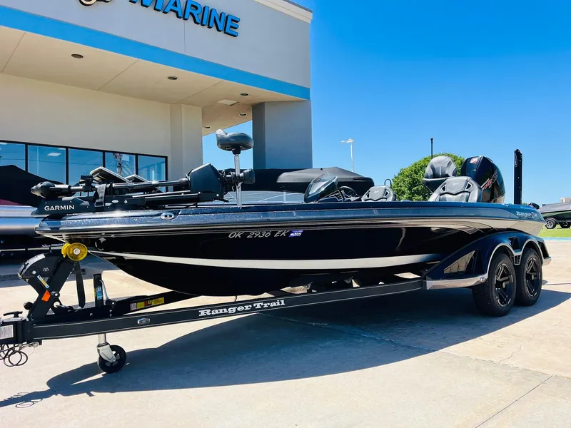 Slide: The Image of 2024 Ranger Z520R Ranger Cup Equipped boat on trailer outside dealership. - 2