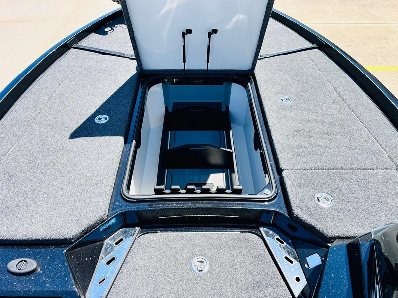Slide: The Image of 2024 Ranger Z520R boat storage compartment with open lid, showcasing spacious interior. - 20