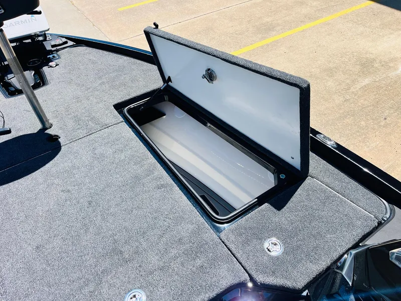 Slide: The Image of 2024 Ranger Z520R boat storage compartment open on deck. - 22