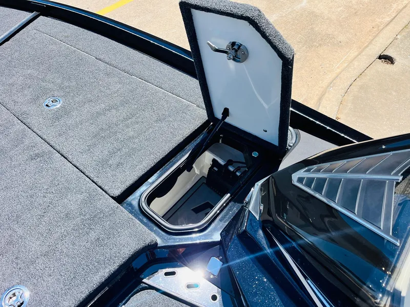 Slide: The Image of 2024 Ranger Z520R Ranger Cup Equipped boat storage compartment open, showcasing interior features. - 24