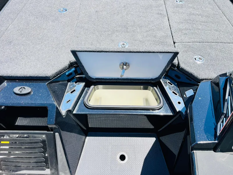 Slide: The Image of 2024 Ranger Z520R Ranger Cup Equipped boat storage compartment with open lid, showcasing interior space. - 27