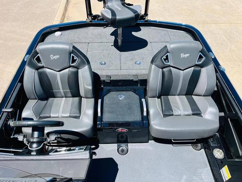 Slide: The Image of 2024 Ranger Z520R Ranger Cup boat interior with dual gray seats and steering console. - 30
