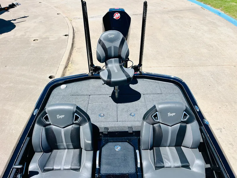 Slide: The Image of 2024 Ranger Z520R Ranger Cup boat interior with three gray seats and fishing deck. - 39