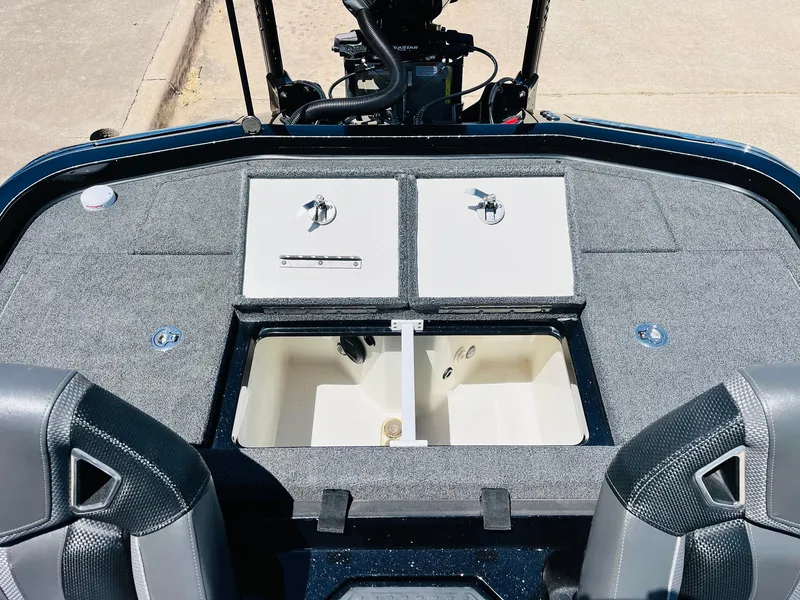 Slide: The Image of 2024 Ranger Z520R boat interior with storage compartments and seating. - 41