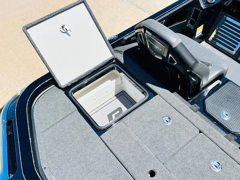 Slide: The Image of 2024 Ranger Z520R boat with open storage compartment and seating area. - 44