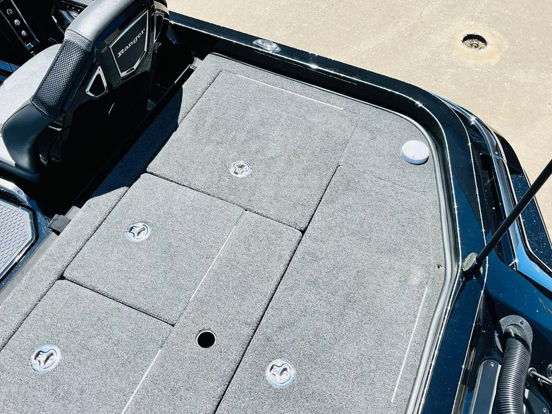 Slide: The Image of 2024 Ranger Z520R Ranger Cup Equipped boat deck with storage compartments and steering wheel. - 46