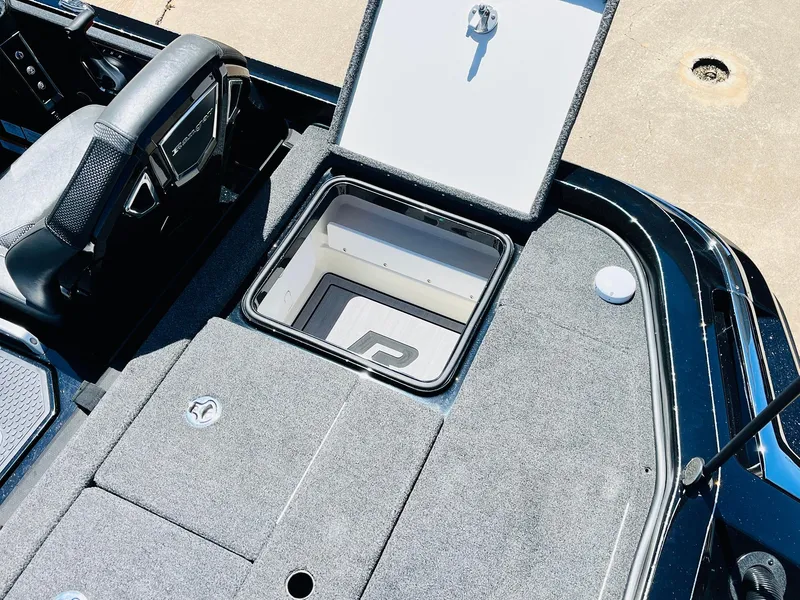 Slide: The Image of 2024 Ranger Z520R boat interior with open storage compartment. - 47
