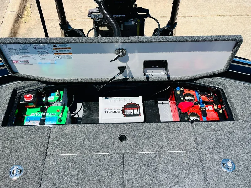 Slide: The Image of 2024 Ranger Z520R Ranger Cup Equipped boat storage compartment with batteries and accessories. - 49