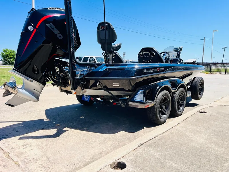 Slide: The Image of 2024 Ranger Z520R Ranger Cup Equipped boat on a trailer, featuring a powerful engine. - 7