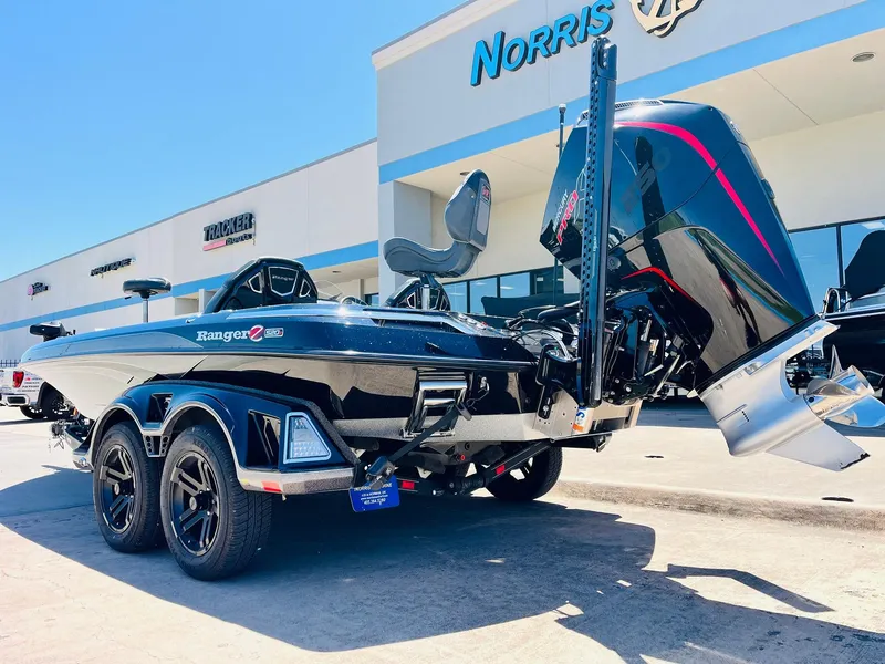 Slide: The Image of 2024 Ranger Z520R Ranger Cup Equipped boat, black, parked outside dealership. - 9