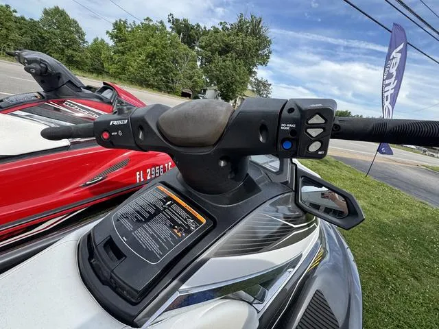 Slide: The Image of 2018 Yamaha WaveRunner VX Cruiser HO handlebars and controls, parked outdoors. - 4