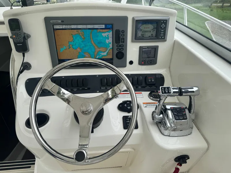 Slide: The Image of Control panel of a 2011 Boston Whaler 305 Conquest boat with navigation equipment. - 10