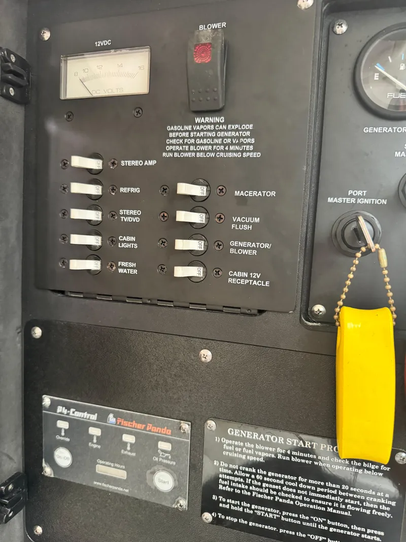 Slide: The Image of Control panel of a 2011 Boston Whaler 305 Conquest boat with switches and generator instructions. - 19