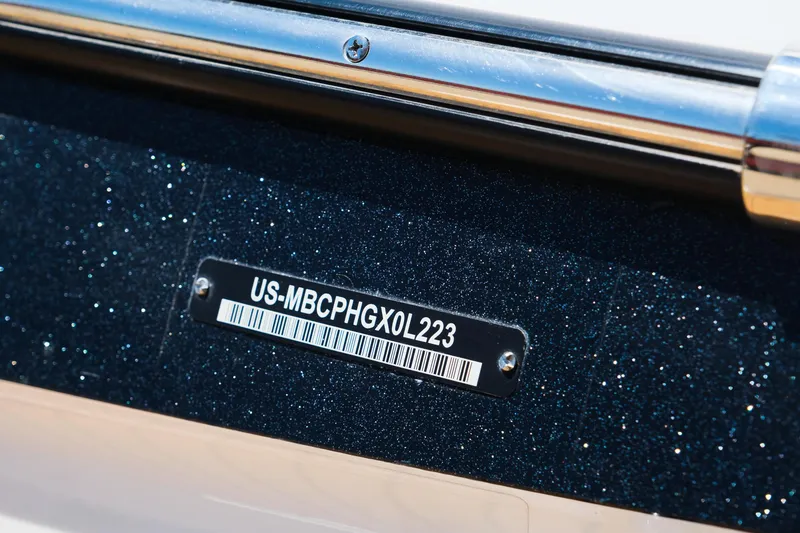 Slide: The Image of 2023 MasterCraft X24 boat identification number plate with barcode. - 11