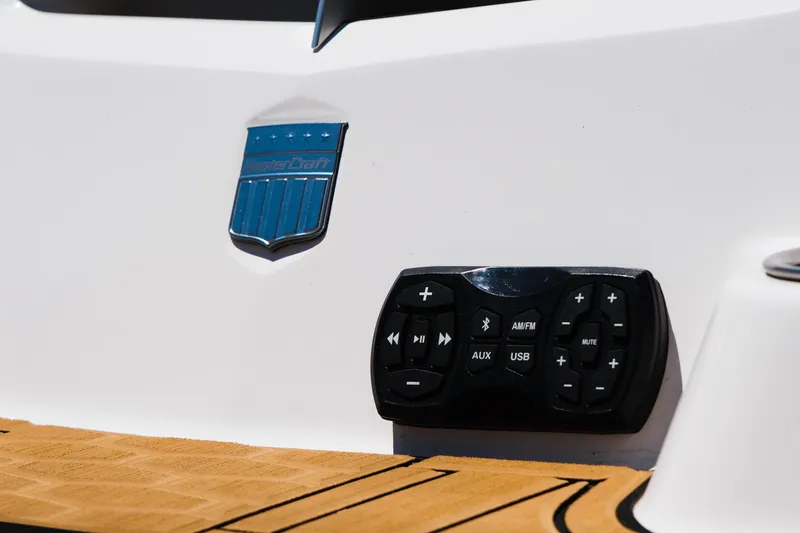 Slide: The Image of 2023 MasterCraft X24 boat control panel and logo on deck. - 12