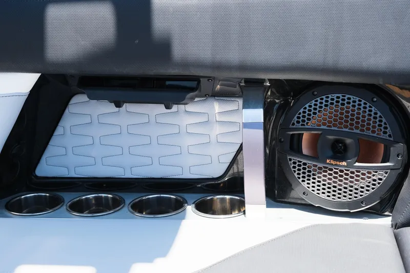 Slide: The Image of 2023 MasterCraft X24 interior with speaker and cup holders, showcasing modern design elements. - 16