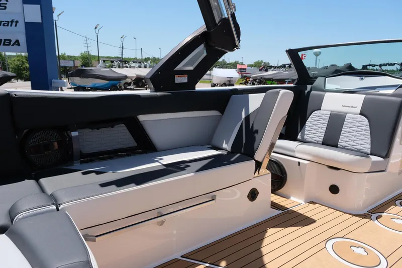 Slide: The Image of 2023 MasterCraft X24 boat interior with sleek seating and modern design. - 17