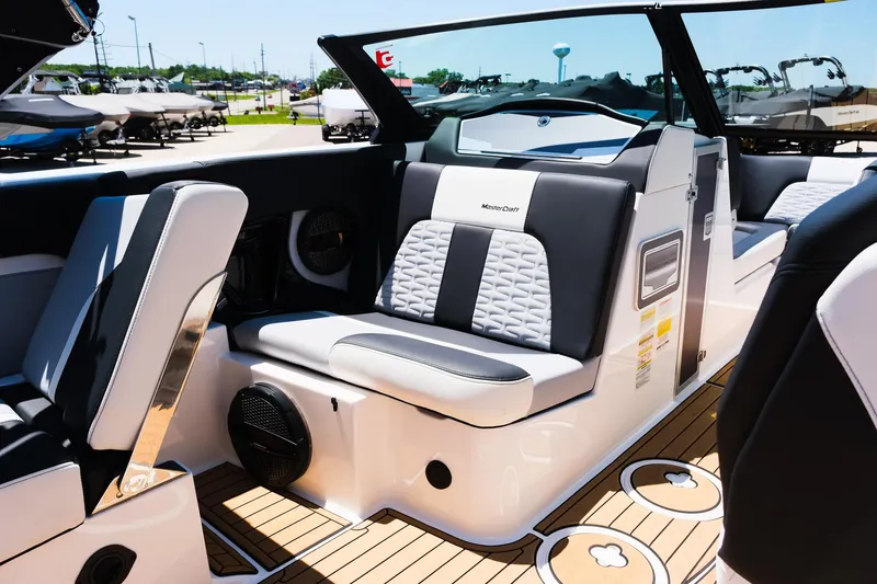 Slide: The Image of 2023 MasterCraft X24 boat interior with luxurious seating and modern design. - 19