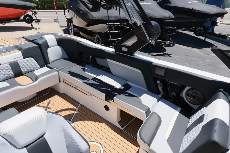Slide: The Image of 2023 MasterCraft X24 boat interior with luxurious seating and modern design. - 20