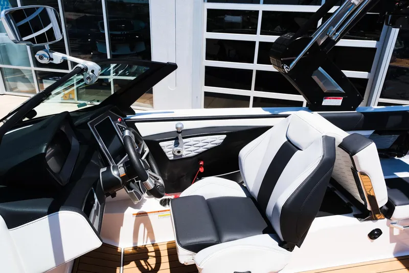Slide: The Image of 2023 MasterCraft X24 boat interior with modern dashboard and seating. - 26