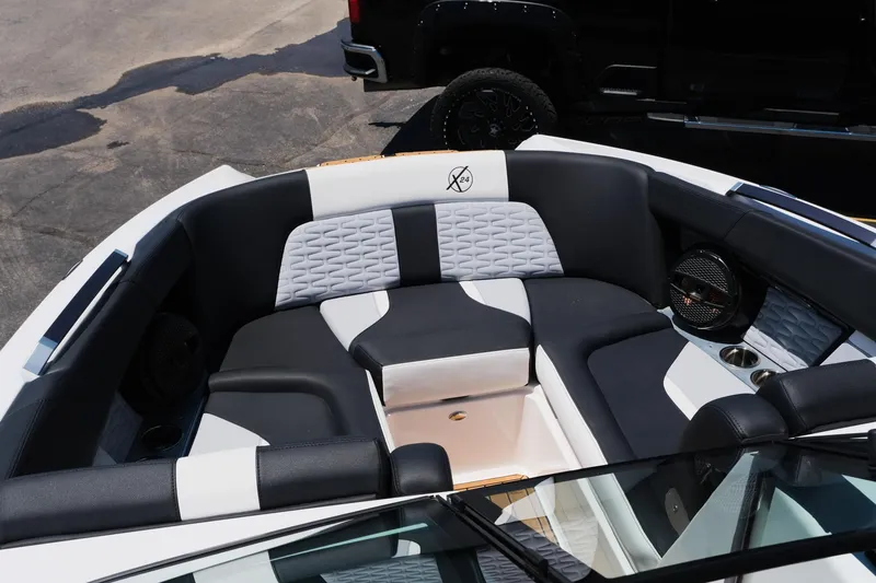 Slide: The Image of 2023 MasterCraft X24 boat interior with stylish seating and modern design. - 28