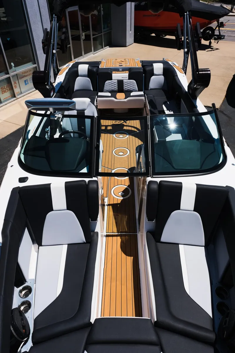Slide: The Image of 2023 MasterCraft X24 boat interior with sleek seating and modern design. - 29