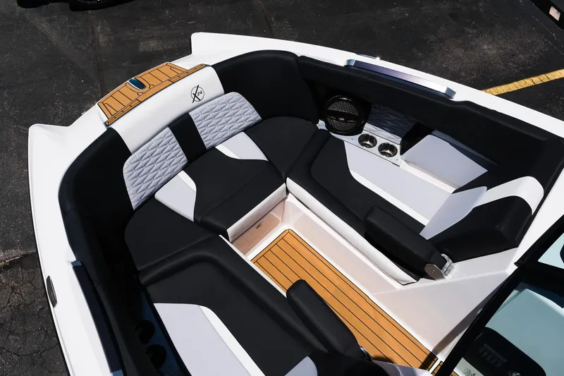 Slide: The Image of 2023 MasterCraft X24 boat interior with stylish seating and modern design. - 31