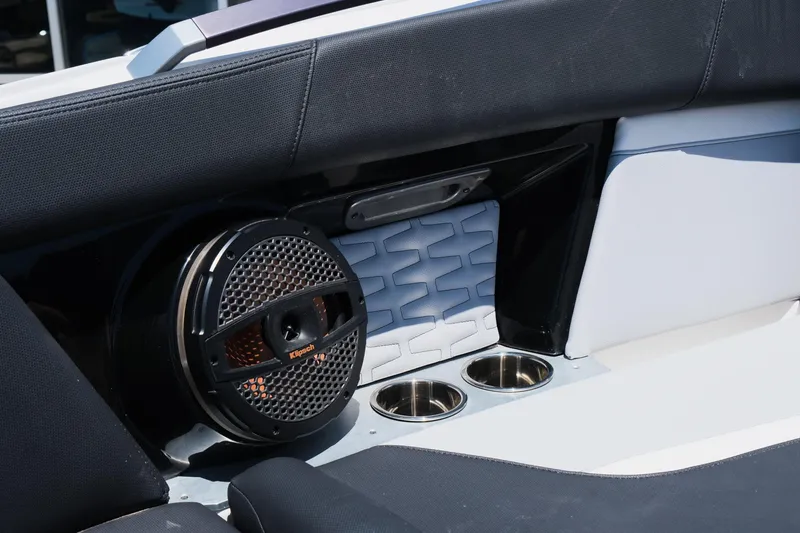 Slide: The Image of 2023 MasterCraft X24 interior with speaker and cup holders, showcasing luxury boat features. - 33