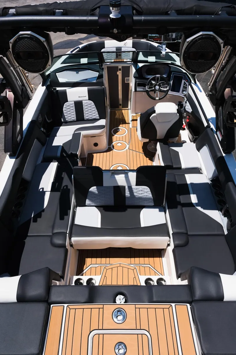 Slide: The Image of 2023 MasterCraft X24 boat interior with luxury seating and modern dashboard. - 35