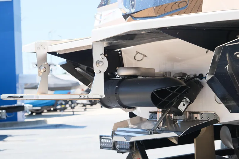 Slide: The Image of 2023 MasterCraft X24 boat stern with advanced propulsion system and trim tabs. - 7