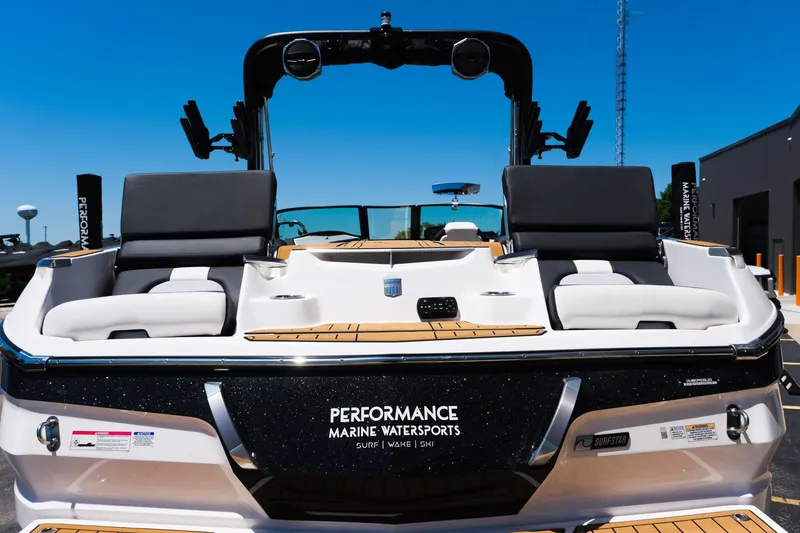 Slide: The Image of 2023 MasterCraft X24 boat with sleek design and comfortable seating at Performance Marine Watersports. - 9
