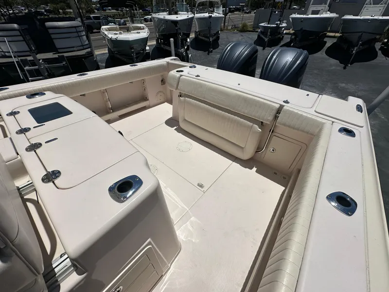 Slide: The Image of 2013 Grady-White Canyon 306 boat interior with seating and storage compartments. - 15
