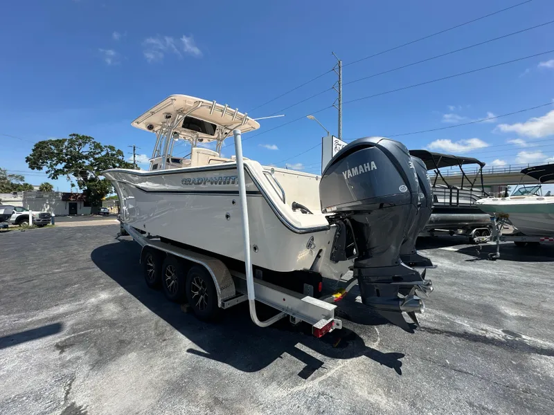Slide: The Image of 2013 Grady-White Canyon 306 boat with Yamaha engine on trailer, parked outdoors. - 3