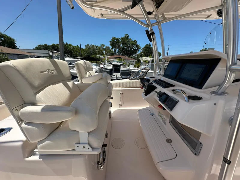 Slide: The Image of 2013 Grady-White Canyon 306 boat interior with helm and seating area. - 33