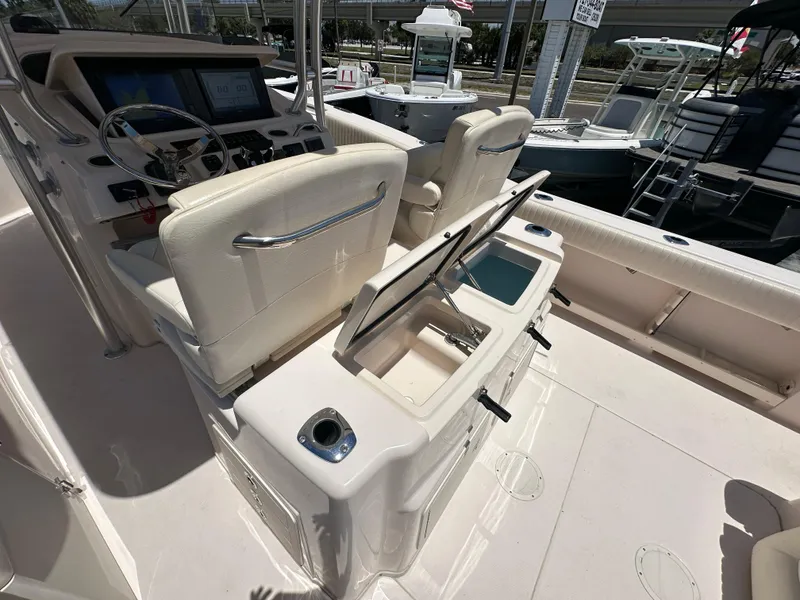 Slide: The Image of 2013 Grady-White Canyon 306 boat interior with helm and seating area. - 35