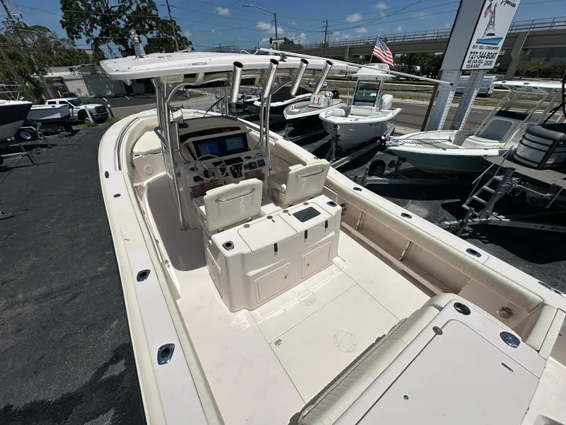 Slide: The Image of 2013 Grady-White Canyon 306 boat with spacious deck and modern controls. - 39