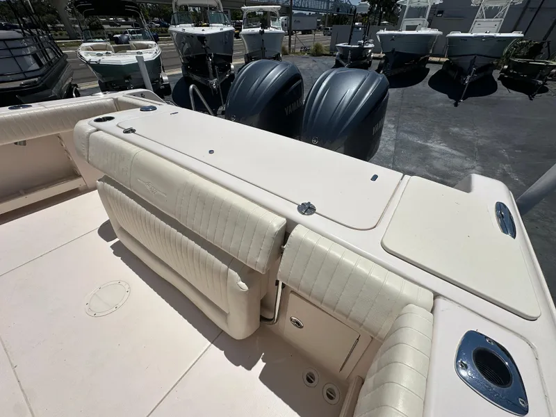 Slide: The Image of 2013 Grady-White Canyon 306 boat interior with seating and dual outboard motors. - 40