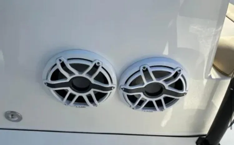 Slide: The Image of Speakers on a 2020 Key West 263 FS boat, featuring a sleek white design. - 14