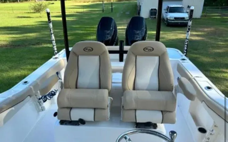 Slide: The Image of 2020 Key West 263 FS boat interior with dual seats and twin engines. - 8