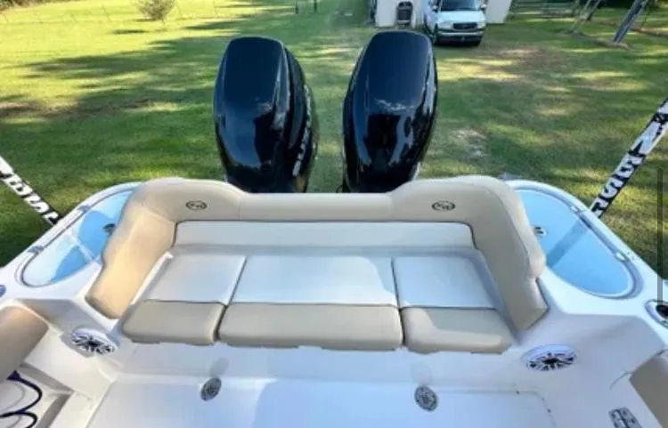 Slide: The Image of 2020 Key West 263 FS boat with dual outboard motors and spacious seating. - 9