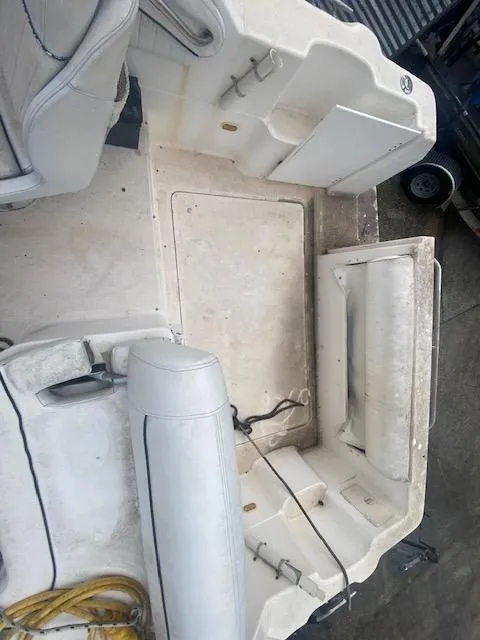Slide: The Image of 1998 Bayliner Ciara 2855 boat interior with seating and storage compartments. - 10